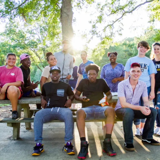 students outside on picnic table