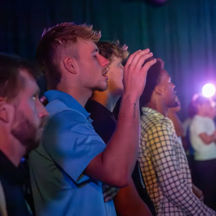 Student worshiping at chapel