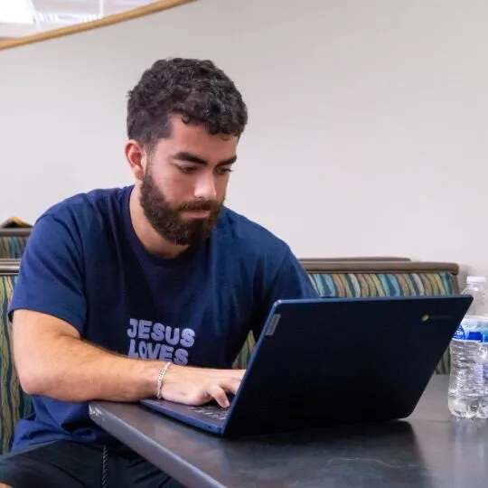 Student working on his computer