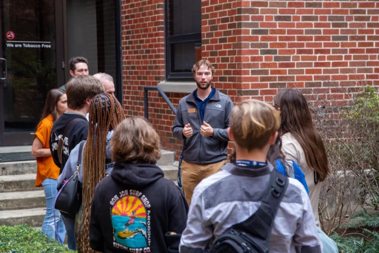 Student worker giving a tour on campus for Pursue