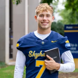 Student holding a Bible