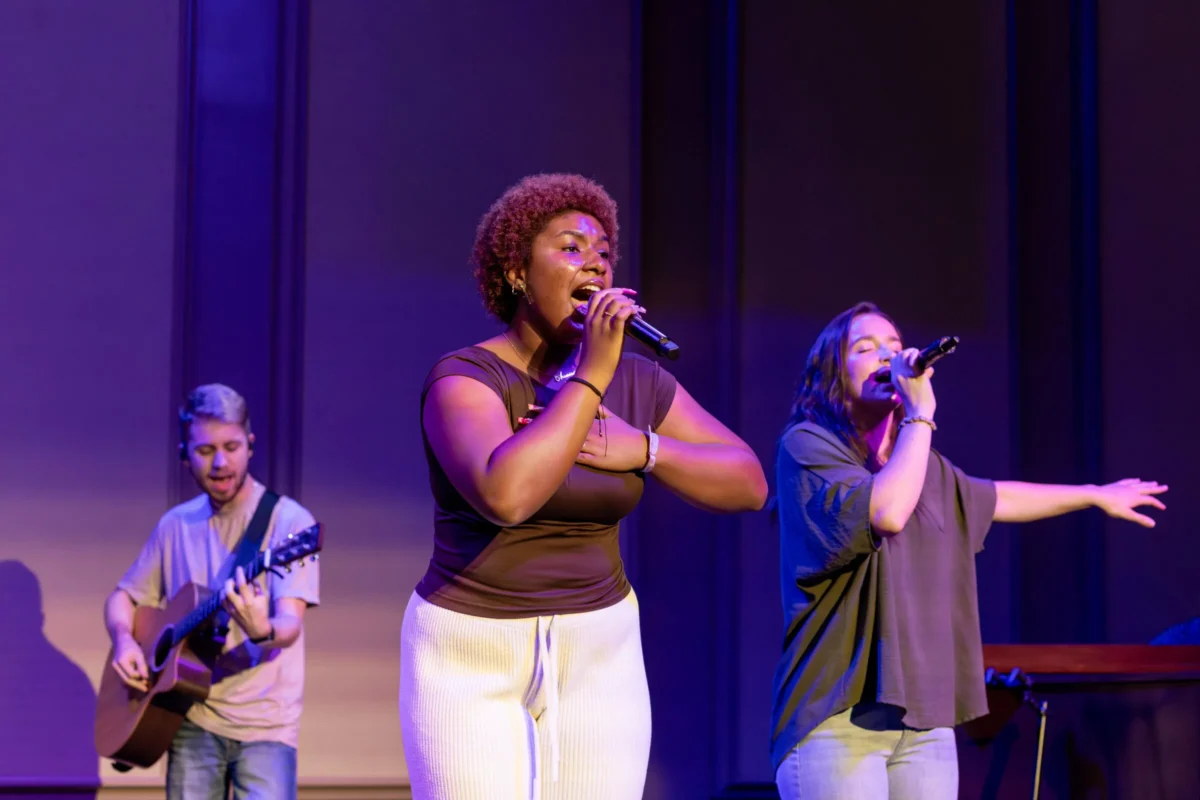 Students singing at chapel